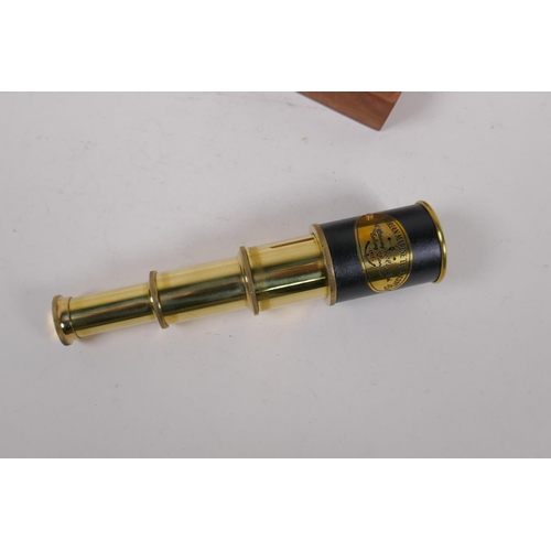 238 - A Victorian style miniature brass marine telescope, boxed, 18cm long extended