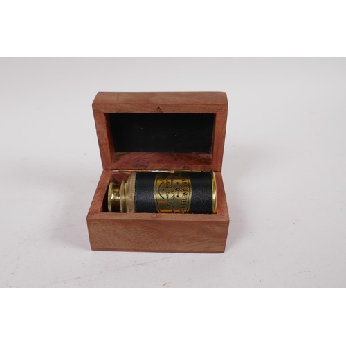 238 - A Victorian style miniature brass marine telescope, boxed, 18cm long extended