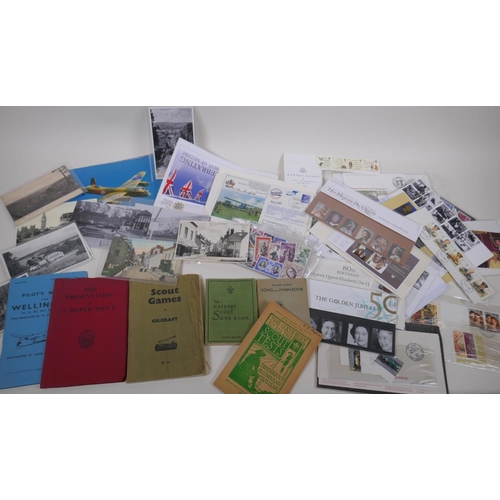 243 - A quantity of ephemera including stamps, first day covers, post cards, scout manuals etc