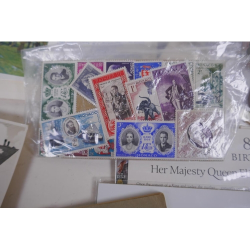 243 - A quantity of ephemera including stamps, first day covers, post cards, scout manuals etc