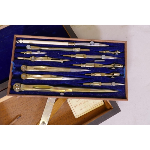 244 - A Victorian rosewood cased set of compasses and draughtsman's instruments, 21cm x 12cm x 14cm