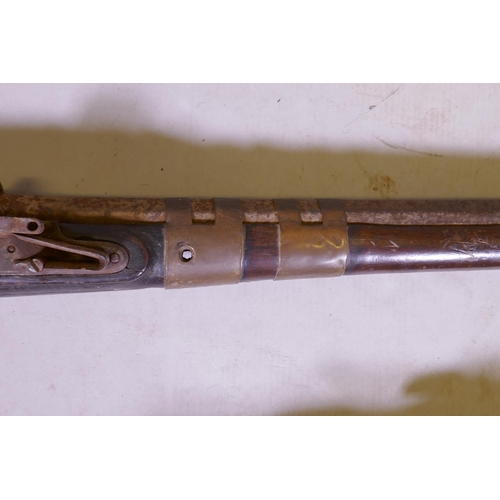 249 - An antique North African Kabyle musket (Moukahla) with brass banded barrel and decorative inlay, ano... 