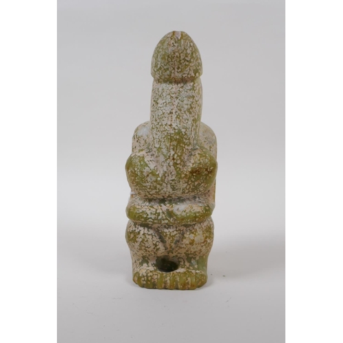 25 - An oriental carved green hardstone fertility figure, 21cm high