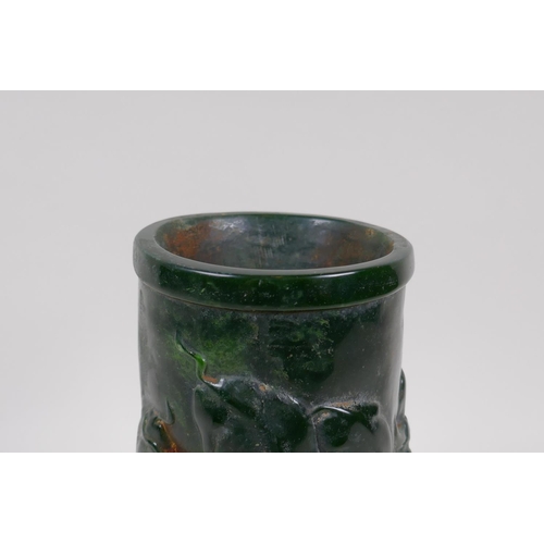 253 - A Chinese reconstituted green hardstone brush pot with raised buffalo decoration, mark to base, 20cm... 