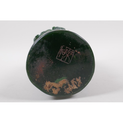 253 - A Chinese reconstituted green hardstone brush pot with raised buffalo decoration, mark to base, 20cm... 