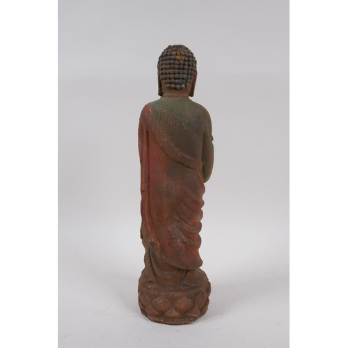 258 - A Chinese carved and painted wood figure of Buddha, 30cm high