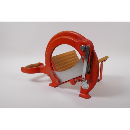 26 - A Danish 1970s cast metal Raadvad bread slicer, 24cm high