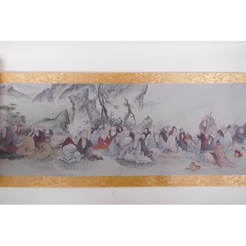 38 - A Chinese printed watercolour scroll depicting an extensive scene with many seated Lohan in conversa... 