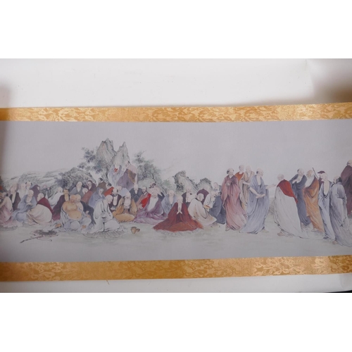 38 - A Chinese printed watercolour scroll depicting an extensive scene with many seated Lohan in conversa... 