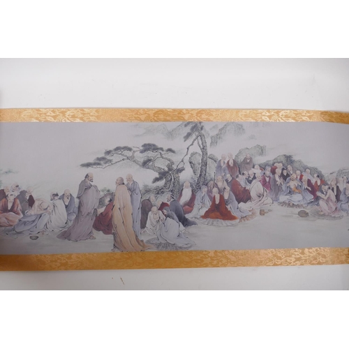 38 - A Chinese printed watercolour scroll depicting an extensive scene with many seated Lohan in conversa... 