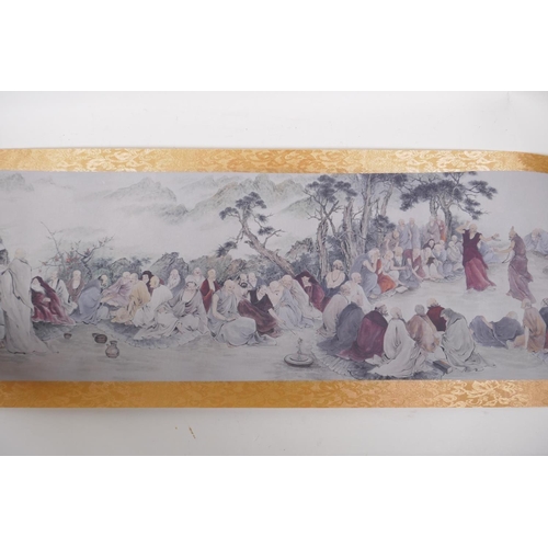 38 - A Chinese printed watercolour scroll depicting an extensive scene with many seated Lohan in conversa... 