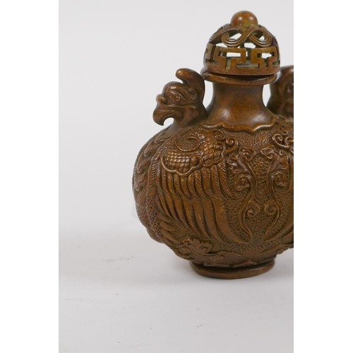 40 - A Chinese bronze snuff bottle with phoenix decoration, impressed 6 character mark to base, 7cm high