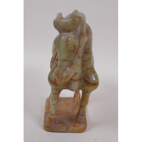 42 - A Chinese carved hardstone figure of a horse, 18cm high