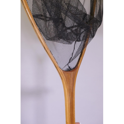 46 - An antique bamboo and cherry fish landing net, 220cm long