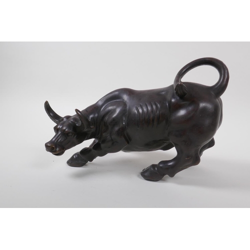 50 - A Chinese filled bronze of a buffalo, 27cm long