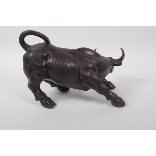 50 - A Chinese filled bronze of a buffalo, 27cm long