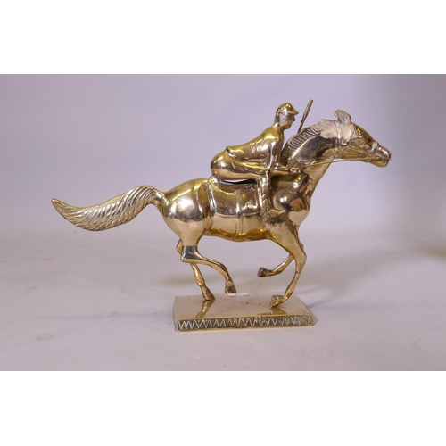 54 - A brass figure of a racehorse and jockey, 39cm high