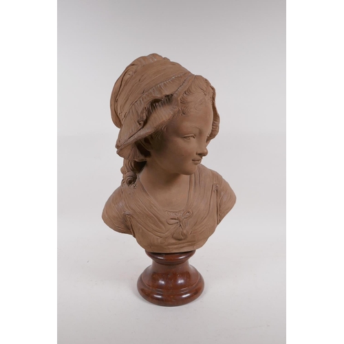 62 - A C19th terracotta bust of a young girl in a bonnet, mounted on a marble socle, 46cm high