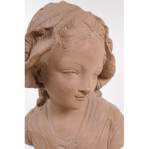 62 - A C19th terracotta bust of a young girl in a bonnet, mounted on a marble socle, 46cm high