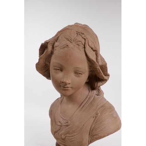 62 - A C19th terracotta bust of a young girl in a bonnet, mounted on a marble socle, 46cm high