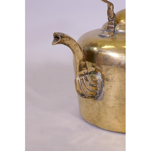 64 - A large Victorian brass kettle, 42cm high