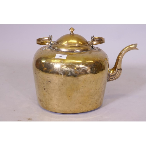 64 - A large Victorian brass kettle, 42cm high