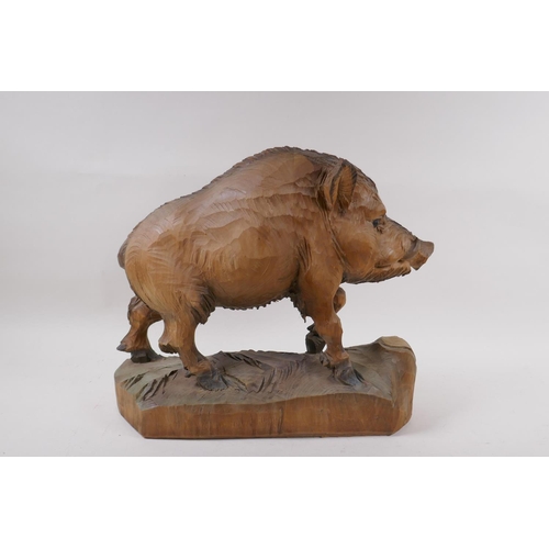 7 - A black forest style carved wood figure of a wild boar, 35cm high