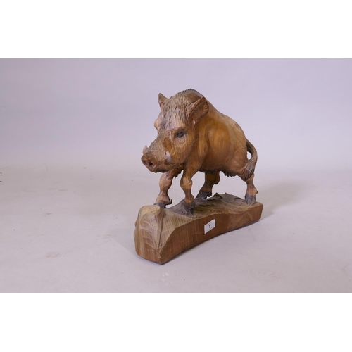 7 - A black forest style carved wood figure of a wild boar, 35cm high