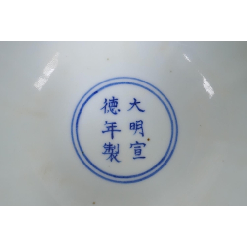 73 - A blue and white porcelain stem bowl with lobed rim and carp decoration, Chinese Xuande 6 character ... 