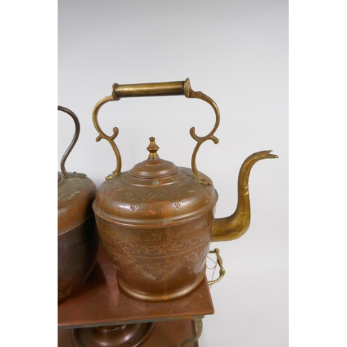 8 - A vintage brass and copper warming stand, 42cm wide, and two C19th copper and brass kettles