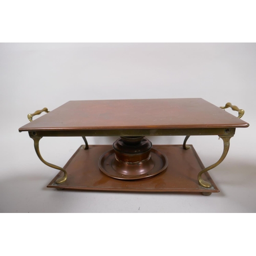 8 - A vintage brass and copper warming stand, 42cm wide, and two C19th copper and brass kettles