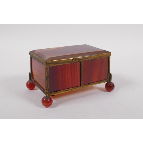 94 - A C19th German banded agate and ormolu trinket box, 13cm x 9cm, 7cm high