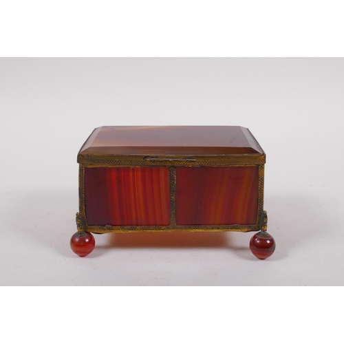 94 - A C19th German banded agate and ormolu trinket box, 13cm x 9cm, 7cm high