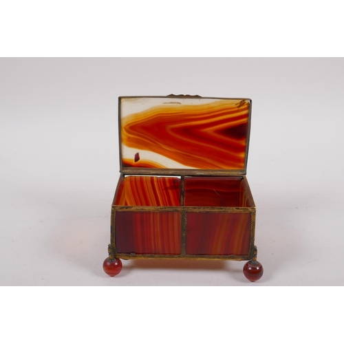 94 - A C19th German banded agate and ormolu trinket box, 13cm x 9cm, 7cm high