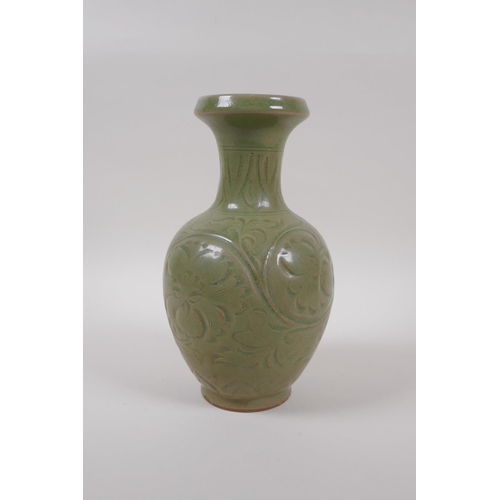 95 - A Chinese olive green glazed porcelain vase with underglaze scrolling floral decoration, 23cm high