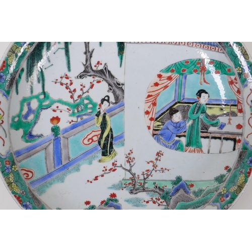 98 - A famille vert porcelain charger decoration with figures in a temple compound, Chinese KangXi 6 char... 