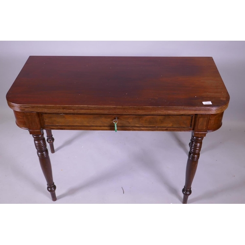 1155 - A Georgian mahogany D shaped dining table with reeded edge fold over top, raised on ring turned supp... 