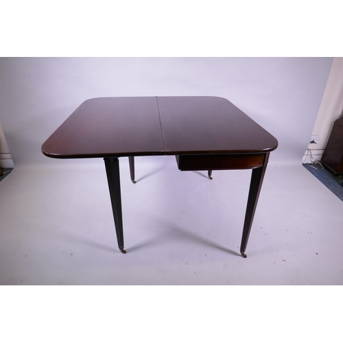 1156 - A Georgian mahogany D shaped tea table, raised on tapering reeded supports with brass castors, 102 x... 