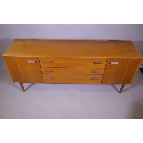 1158 - A mid century E Gomme, G Plan teak dressing table with two cupboards flanking three drawers, 162 x 4... 