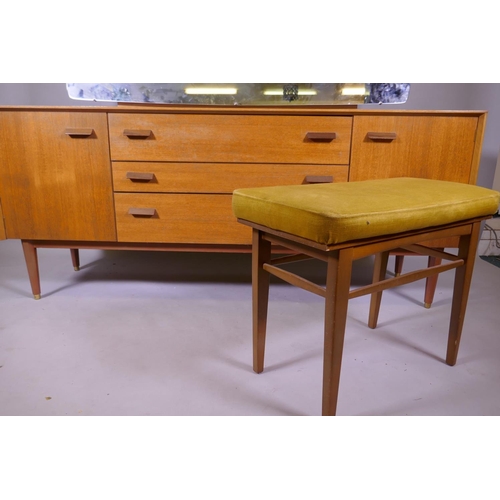 1158 - A mid century E Gomme, G Plan teak dressing table with two cupboards flanking three drawers, 162 x 4... 