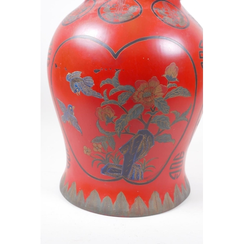 14 - A Chinese lacquered jar and cover decorated with birds amongst flowering trees, and symbols, 41cm hi... 