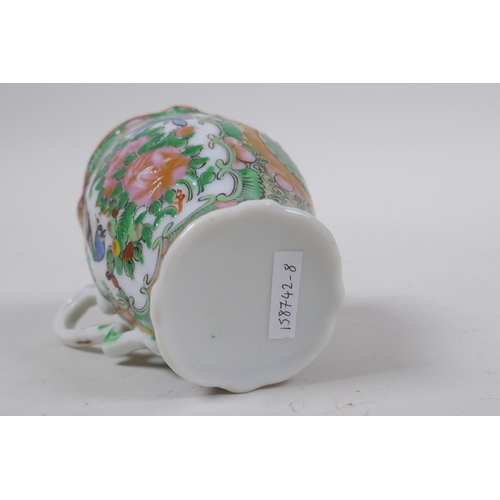 15 - A canton enamelled porcelain beaker with figural and floral decoration, 7cm high