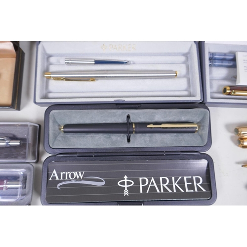 17 - A collection of pens, Parker Laque, Duofold with 14ct gold nib, gold plated fountain pen and propell... 