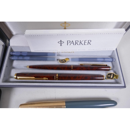 17 - A collection of pens, Parker Laque, Duofold with 14ct gold nib, gold plated fountain pen and propell... 