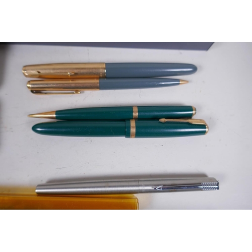 17 - A collection of pens, Parker Laque, Duofold with 14ct gold nib, gold plated fountain pen and propell... 