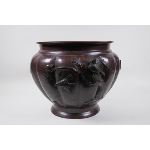 19 - A Japanese Meiji period bronze planter with embossed and applied decoration of birds on fruiting bra... 