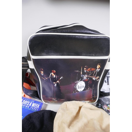 2 - A quantity of Beatles memorabilia including two bags, three Apple Corps caps, Eight Day a Week DVD, ... 