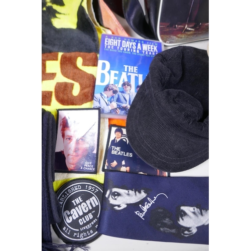 2 - A quantity of Beatles memorabilia including two bags, three Apple Corps caps, Eight Day a Week DVD, ... 