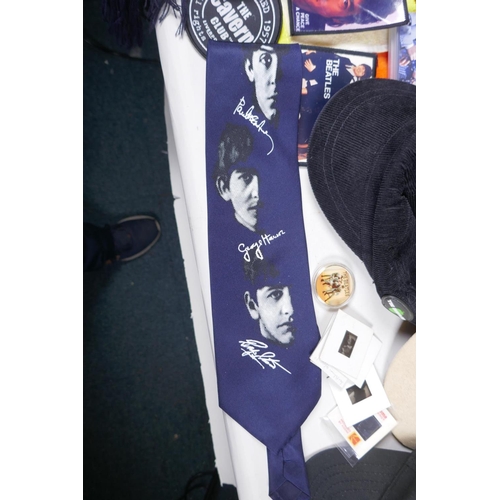 2 - A quantity of Beatles memorabilia including two bags, three Apple Corps caps, Eight Day a Week DVD, ... 