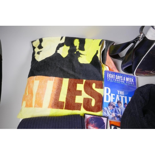 2 - A quantity of Beatles memorabilia including two bags, three Apple Corps caps, Eight Day a Week DVD, ... 